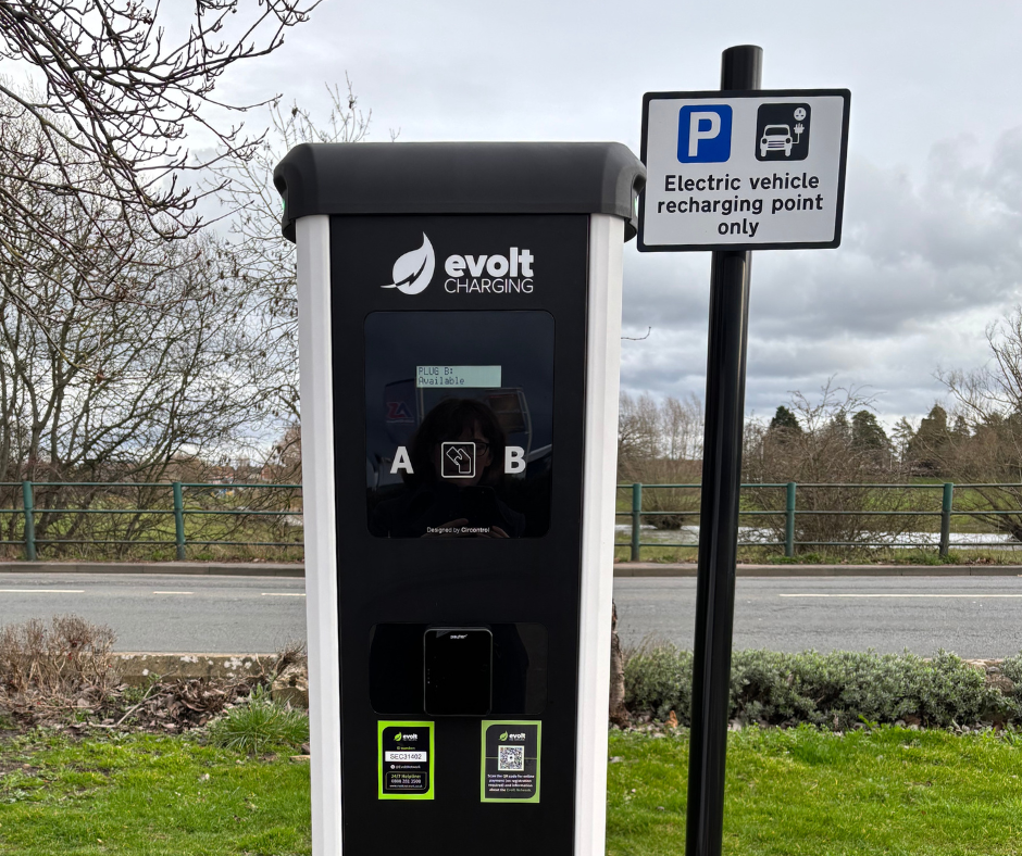 An image of an EV charging unit in Gloucester Road car park. The river Severn is pictured in the distance